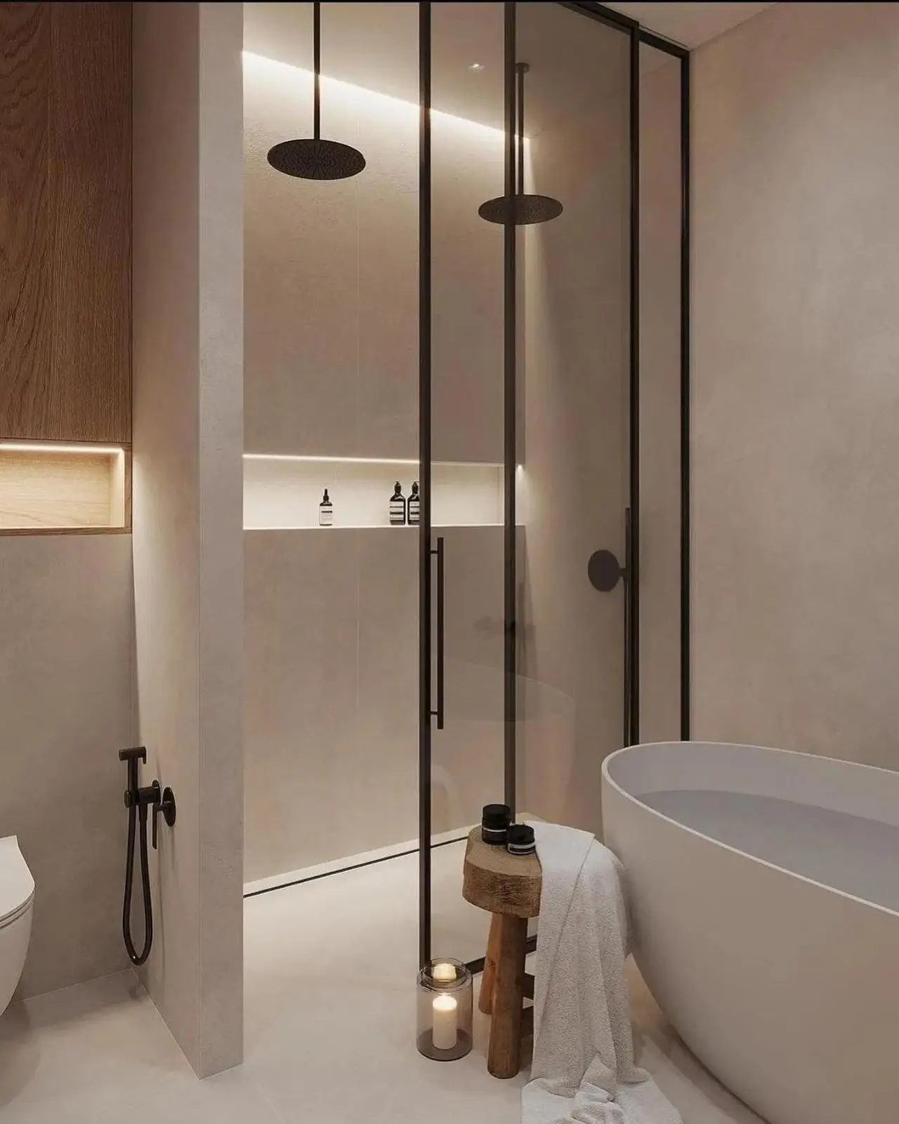 Reforma de baño con mampara de perfilería negra, ducha de obra y bañera exenta en Madrid